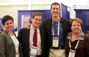 Four colleagues pose for a photo at a MASCC/ISOO Annual Meeting