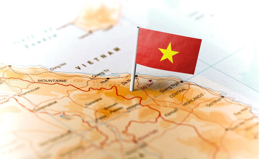 A map of Vietnam marked with the Vietnamese flag